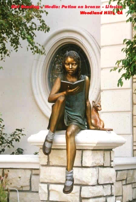girl reading sculpture